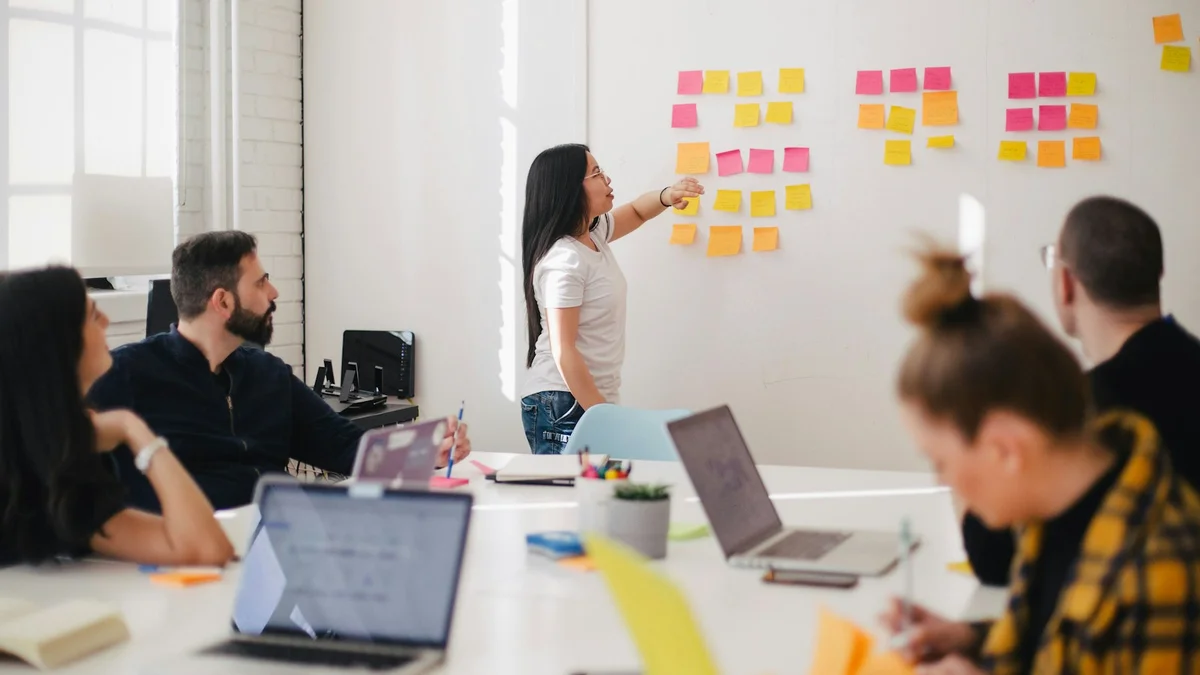 Healthcare clinical informatics and digital strategy team analyzing medical entity relationships and search intent taxonomy during an executive planning session