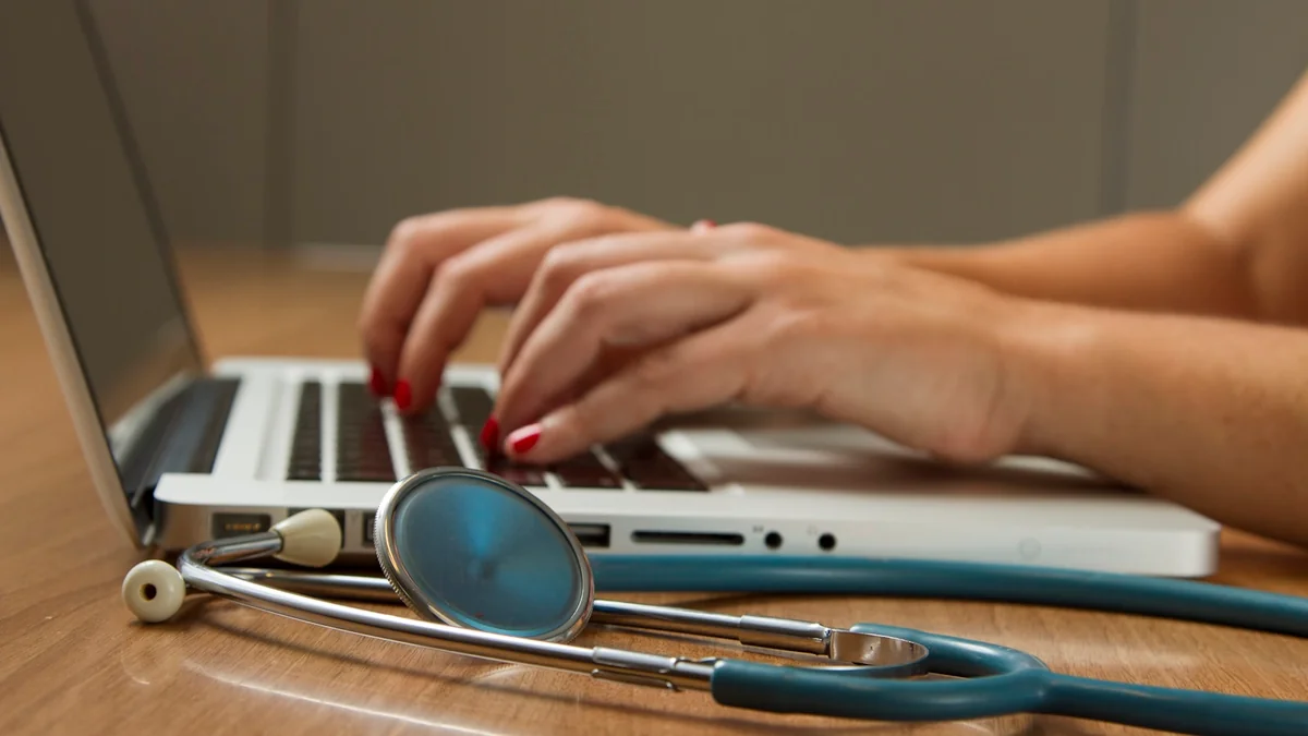 Clinical operations director and physician analyzing automated AI patient triage workflows and privacy compliance guardrails